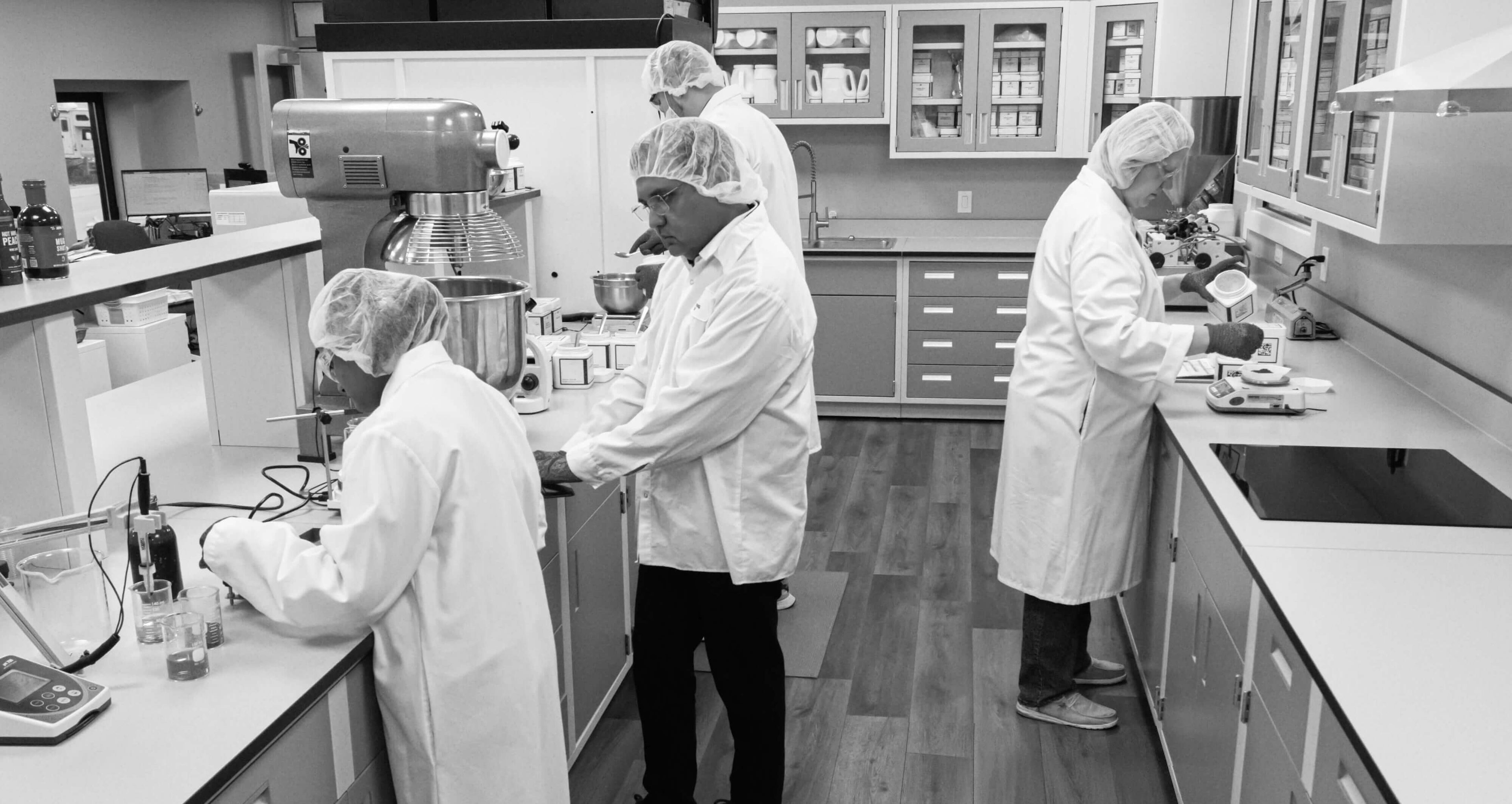 Laboratory setting with scientists working at counters